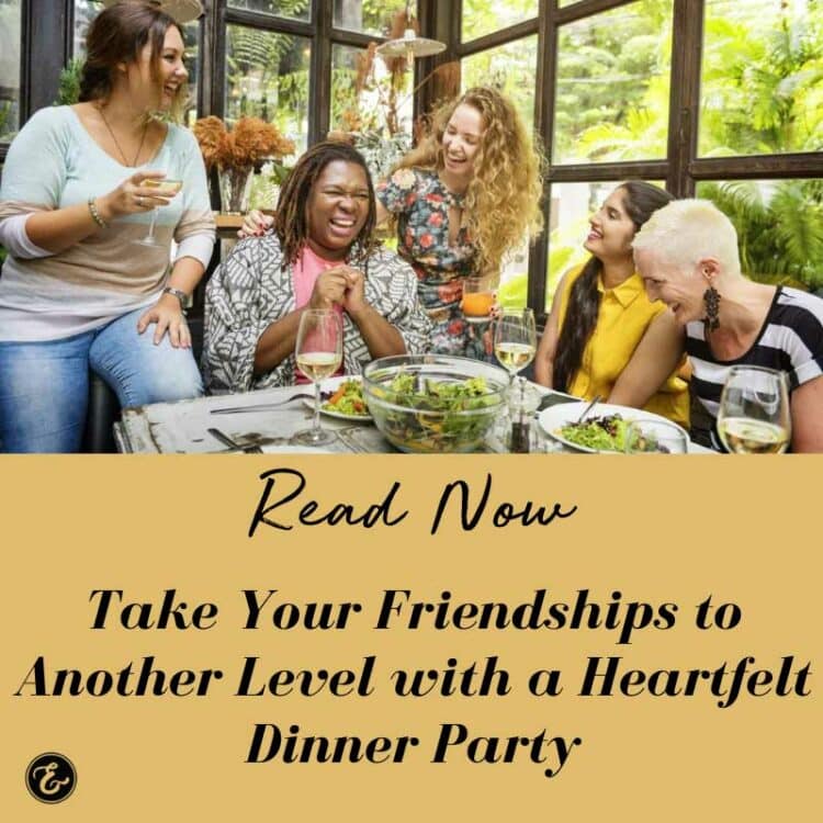 a large group of women laughing around a table during a heartfelt dinner party