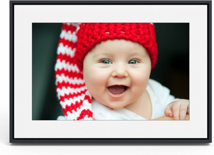 black border picture frame with image of a baby smiling