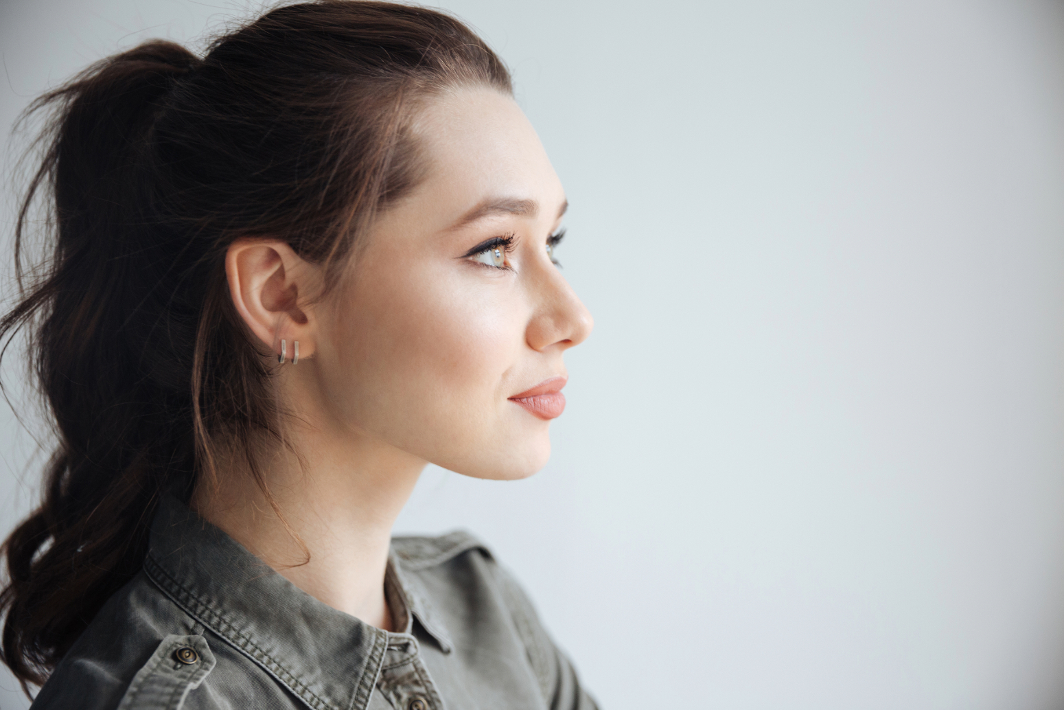 side profile on brunette woman looking confidently ahead and ready to defeat negative self-talk