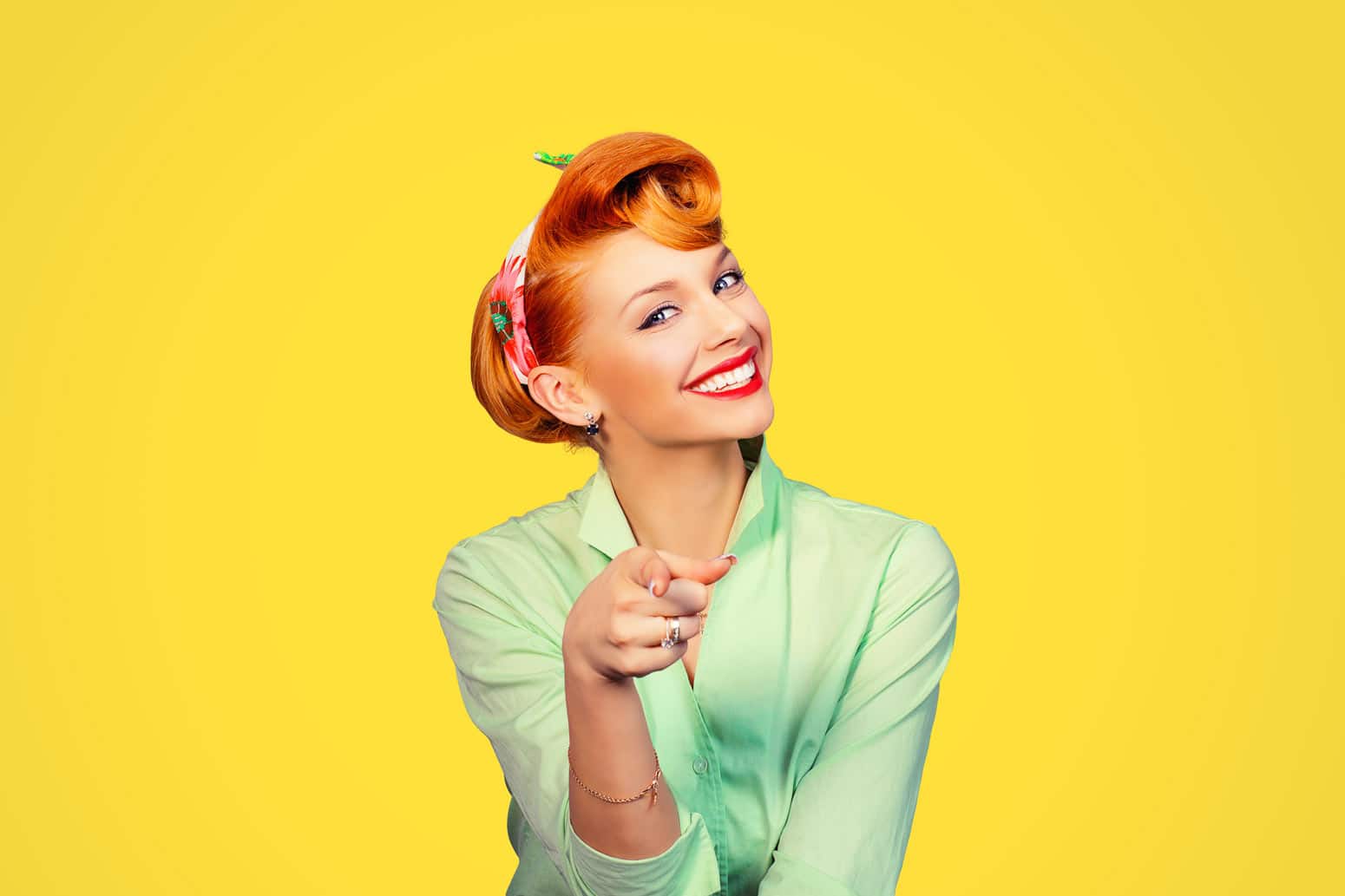 a 1950s-era woman grinning and pointing at us, a fun, symbolic of a fresh start if past resolutions failed you