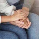 close up of couple holding hands, a symbol of connecting during a moment of trying to save your marriage