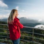 woman overlooking a mountain vista pondering how to live a life with a mission