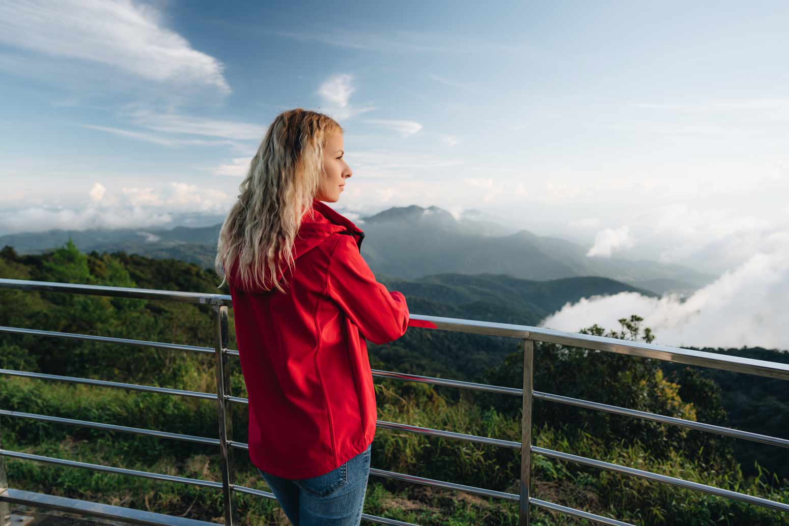 woman overlooking a mountain vista pondering how to live a life with a mission